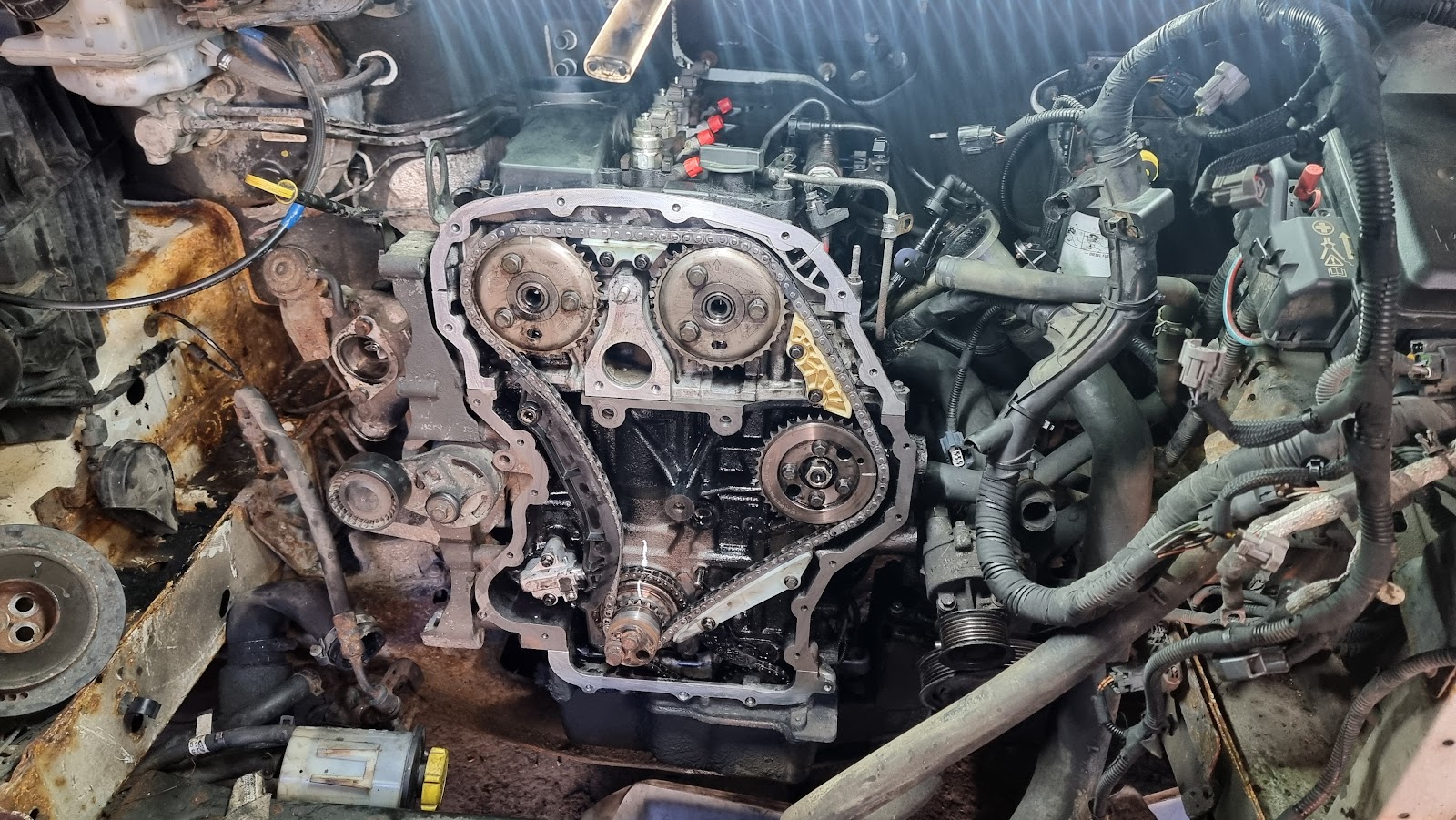 Engine work on the bench at C & G Motors — timing chain and internals open